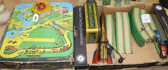 Three tinplate toys, c.1950, to include a Mar Futurmatic Airport, and a vintage Rowntree tin (4)